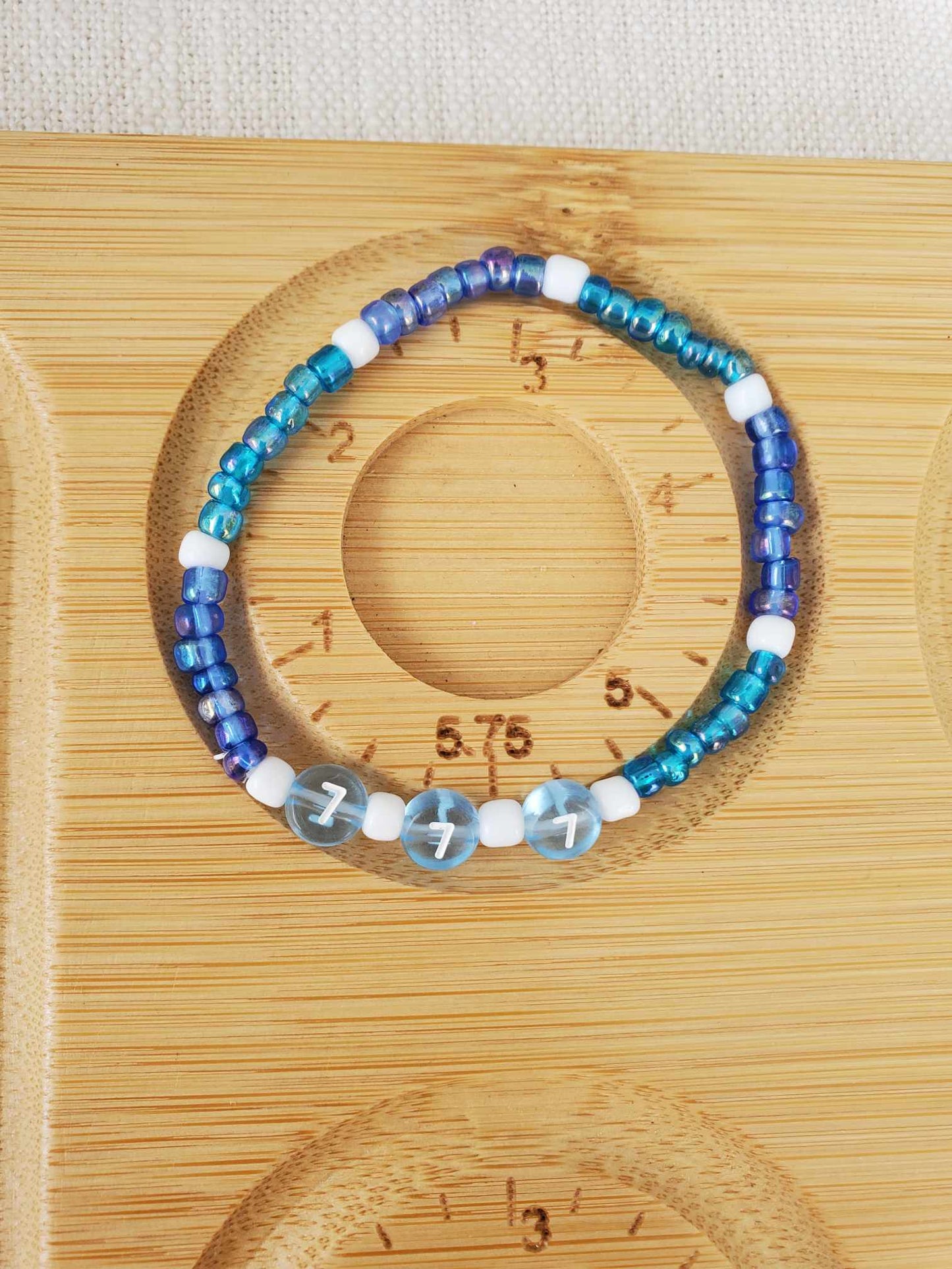 Angel Number 777 (Blue & White)