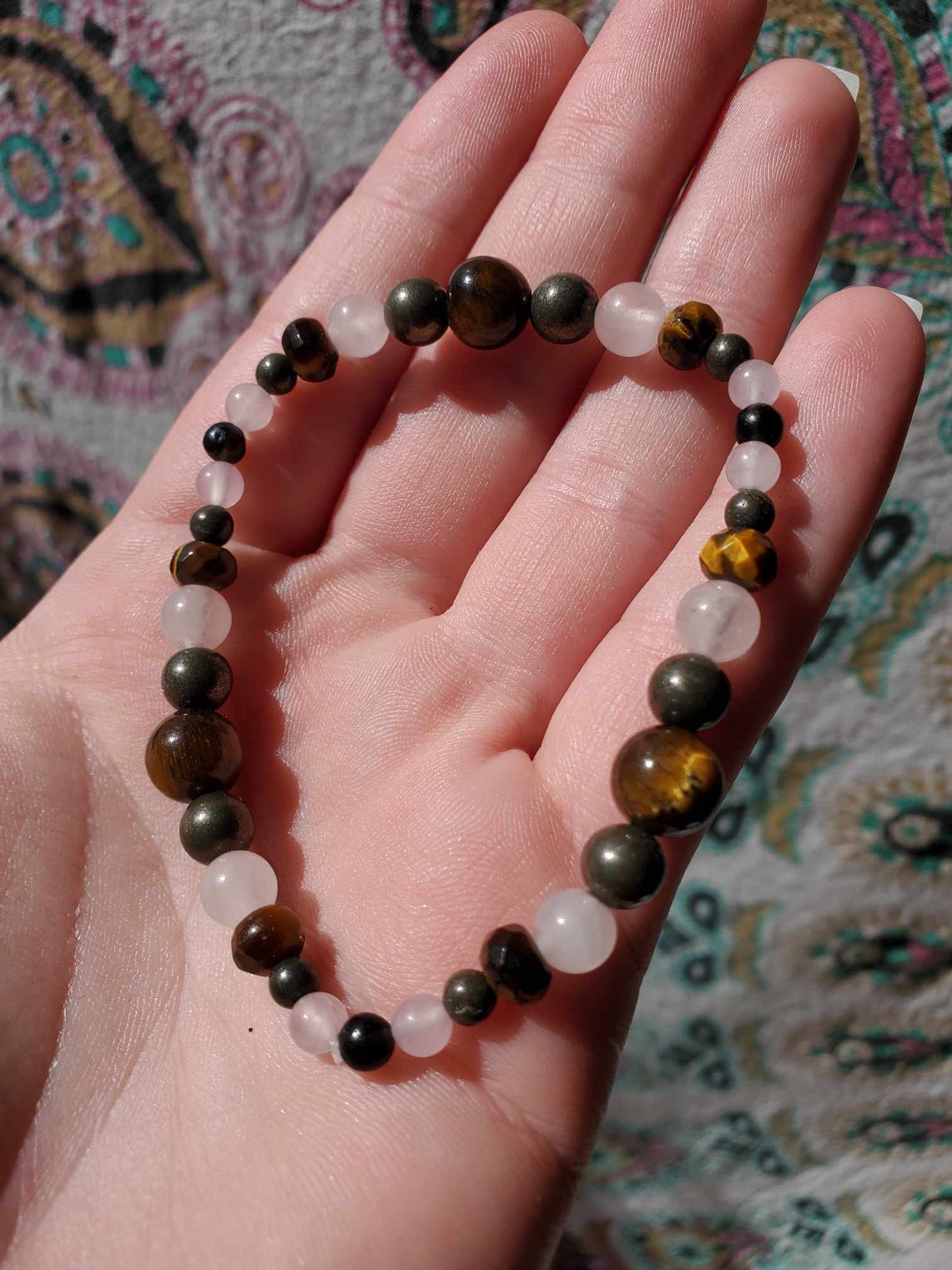 Pyrite, Tiger's Eye, Obsidian, and Rose Quartz