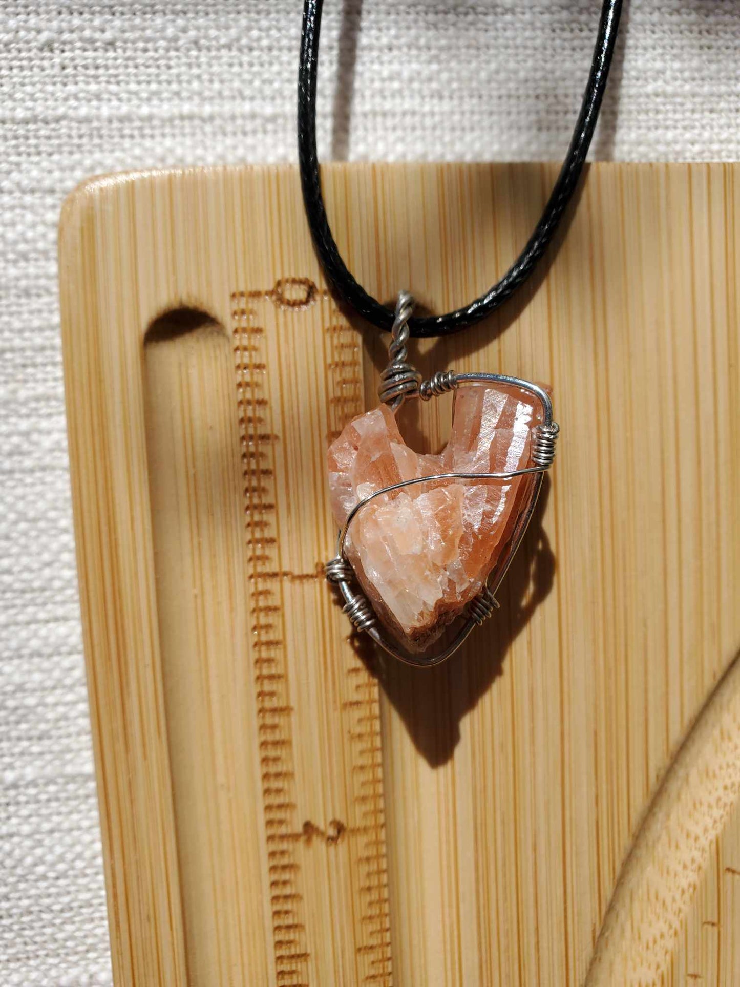 Red Calcite Root in Silver Wire